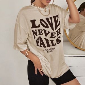 love never fails graphic tee